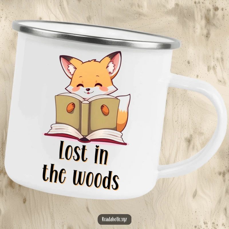 Funny kawaii fox camping mug showing a cute fox engrossed in reading a large book, ready for outdoor adventures.