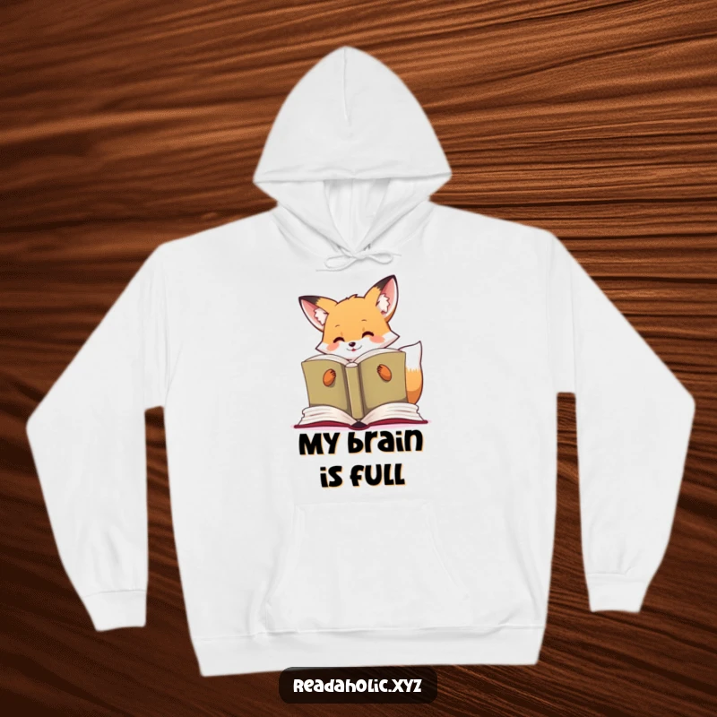 Funny kawaii fox hoodie depicting a cute fox happily reading a massive, open book, lost in its pages.