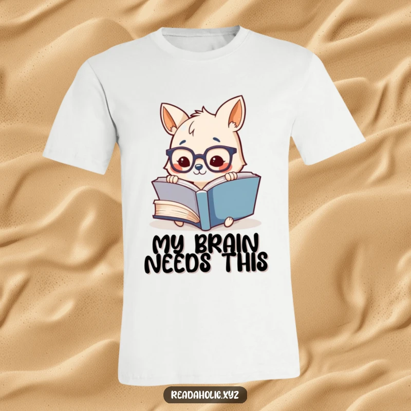 Funny t-shirt showcasing a cute, studious animal character with glasses, joyfully engrossed in reading an enormous book.